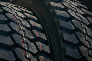 Car tires texrture background, close-up. New black tire texture