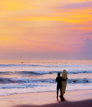 Surfer stay on the beach