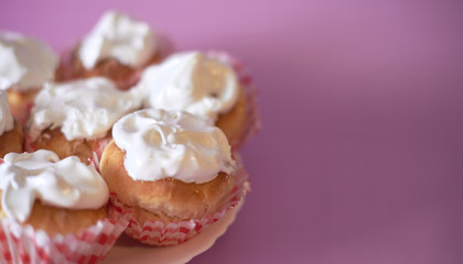 Pink cupcake decorated on a blurred background