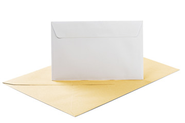 Two envelopes in white and kraft paper on isolated white background with shadows