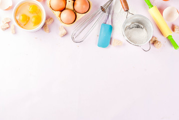 Fototapeta na wymiar Ingredients and utensils for cooking baking egg, flour, sugar, whisk, rolling pin, on light pink background, copy space top view