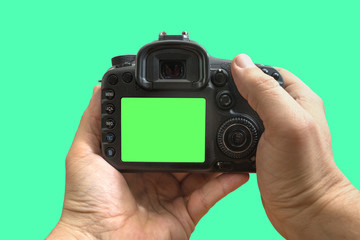 Camera in hands on isolated green screen, path included