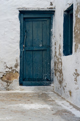 Colorful wooden door of abandoned house