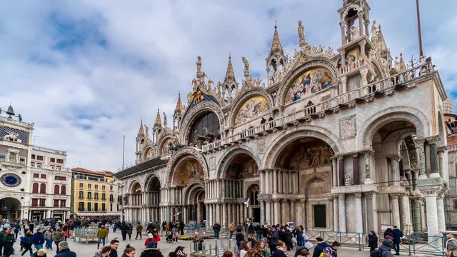 Timelapse of Campanile di San Marco and Palazzo Ducale Doge's Palace in Venice, Italy. Columns of San Marco and San Todaro. Blue cloudy sky at 4K