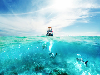 Divers and Boat in the Caribbean Sea