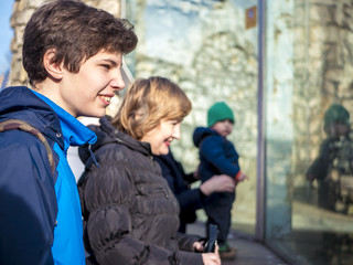 adult wother with teenager son in the zoo