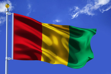 The silk waving flag of Guinea with a flagpole on a blue sky background with clouds .3D illustration.