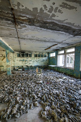 Gas masks on the floor in the middle school in Pripyat, Chernobyl exclusion zone. Nuclear catastrophe