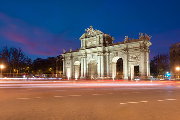 Fototapeta na wymiar Puerta de Alcala is a one of the Madrid ancient doors of the city of Madrid, Spain. It was the entrance of people coming from France, Aragon, and Catalunia. It is a landmark of the city..
