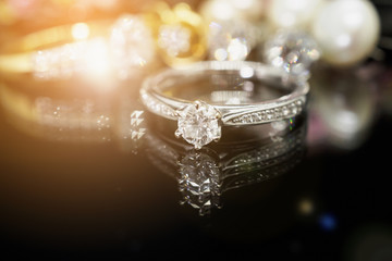 Jewelry diamond rings with reflection on black background