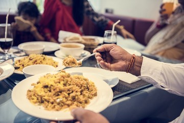 Obraz na płótnie Canvas Family having Indian food