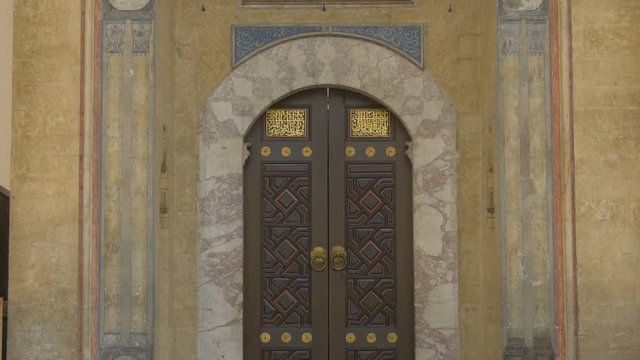 Tilt up of Gazi Husrev-beg Mosque's facade