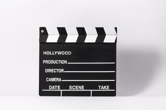 Movie clapperboard on white background