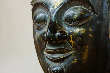 Close up of bronze Buddha statue in Laos