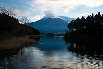 Mt. Fuji over Lake Tanuki in the Cloudy Morning