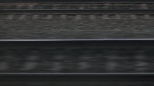 Close View Of Railroad Track Moving At High Speed. Camera moves along railway.