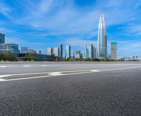 Fototapeta na wymiar empty urban road with modern skyline in the city