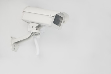 CCTV security camera installed on the building wall, operating indoor and outdoor, surveillance system.