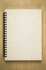 brown notebook or sketchbook on wooden table