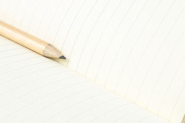 pencil and blank opened notebook