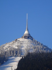Hotel and transmitter Jested with ski slope in winter time, Czech Republic