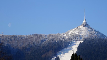 Hotel and transmitter Jested with ski slope in winter time, Czech Republic