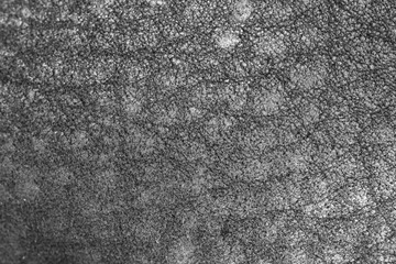 Black leather material as an abstract background