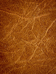 Brown leather material as an abstract background