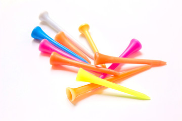 Colorful golf tees isolated on white, includes clipping paths colorful background.