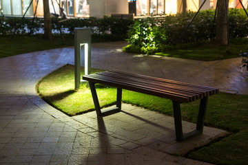Plakat Garden glowing decoration light in the park at night with park bench