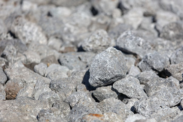 Stone crushed stone on the construction site as an abstract background