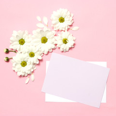 beautiful composition of flowers to the day of the mother. postcard "happy mother's day" on a pastel background with flowers. congratulation. minimalism, top view. flat lay  