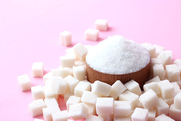 A handful of sugar on a pastel background with a place to paste the text. sugar cubes and loose. minimalism, the top 