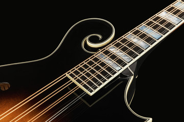 Fototapeta na wymiar Mandolin isolated on black background. Music concept.