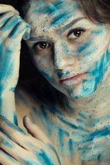 portrait of a girl with paints on her face