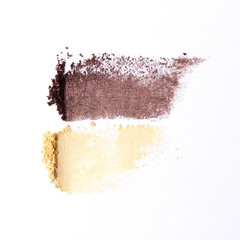 several cosmetic eye shadow shadows of different colors for the eyes on a white background. a...