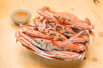 Flower crab group steamed on wood background