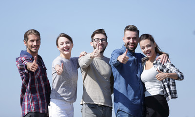 group of young people showing thumb up