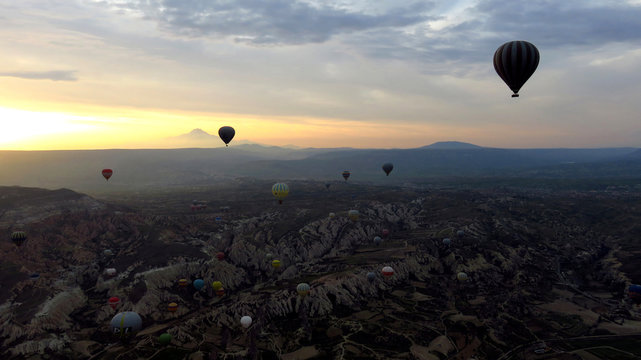 Panorama of Hot Air Balloons Flying Over Cappadocia at Dawn