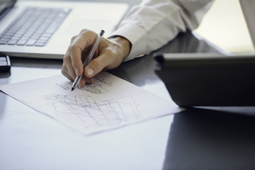 Man working with blueprints