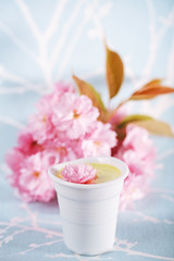 Turmeric latte or golden milk with blossom