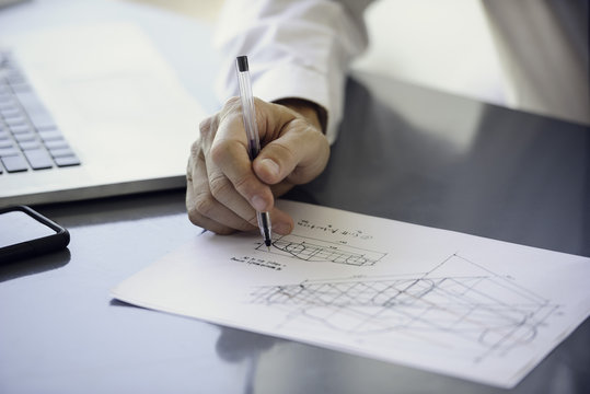 Man working with blueprints