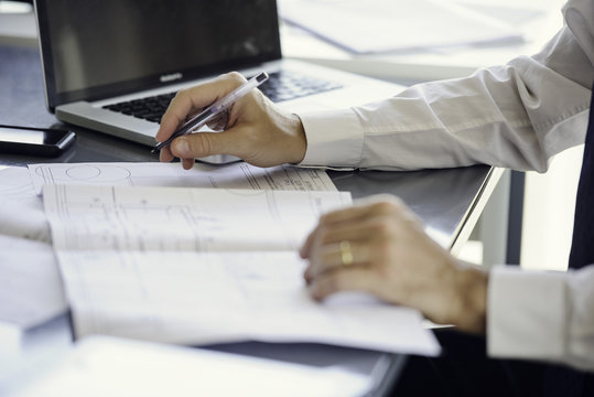 Man working with blueprints