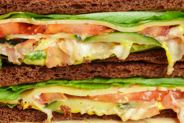 Club sandwich on wooden table