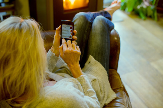 Woman using smartphone at home