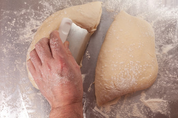 Fototapeta premium Hand shaping and preparing bread