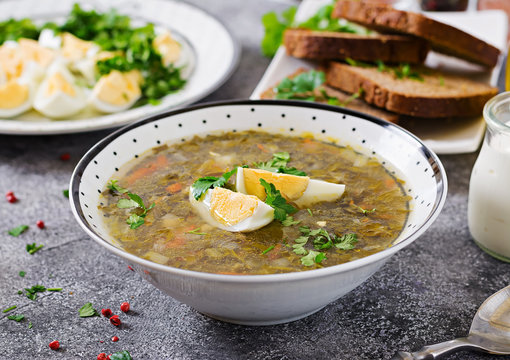 Green sorrel soup with eggs. Summer menu. Healthy food.
