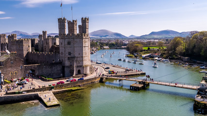 Aerial view of the historic castle Caernafon, Gwynedd in Wales - United Kingdom - obrazy, fototapety, plakaty