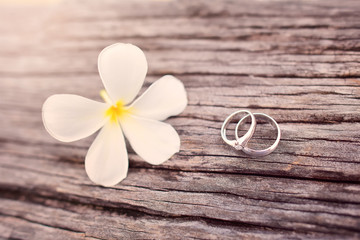 Fototapeta na wymiar Wedding rings on wooden background