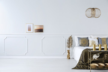 Elegant bedroom with golden decorations